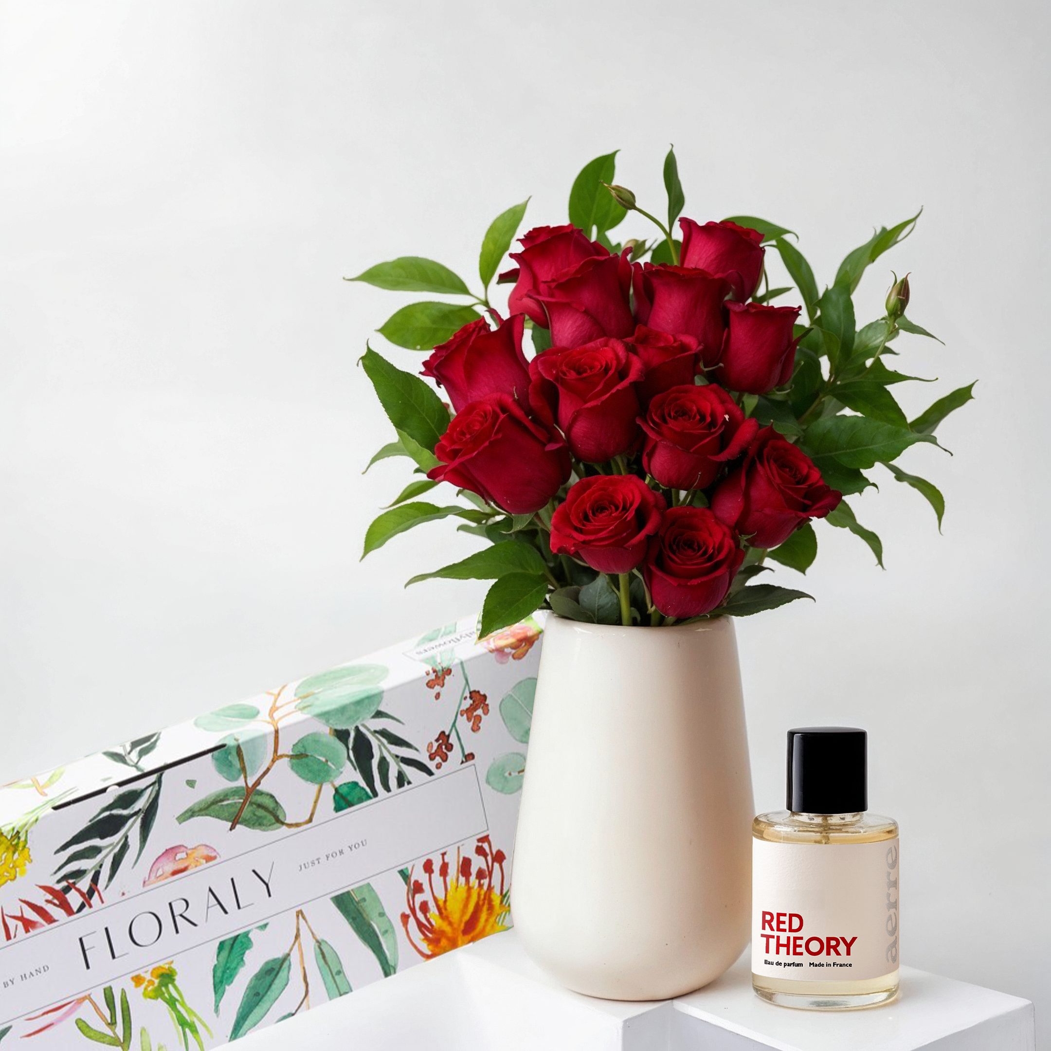 red roses and Red Theory Perfume