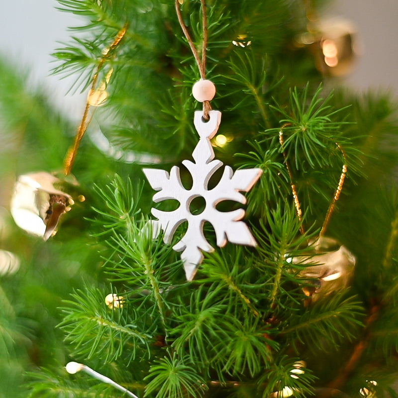 White wooden star on a Christmas tree